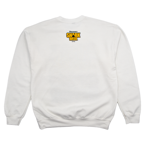 A white crewneck sweatshirt shown from the back, featuring a small yellow and black 'Discovery Shark Week' graphic printed on the upper back.