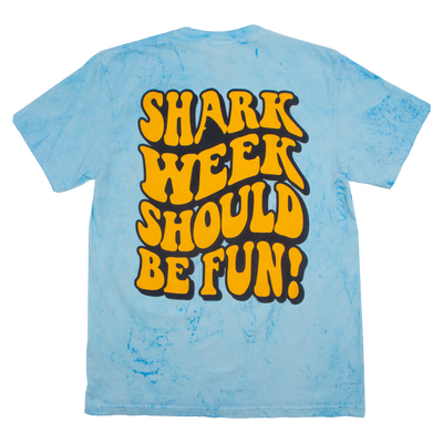 A light blue marble t-shirt shown from the back, featuring a large retro-style graphic that reads 'SHARK WEEK SHOULD BE FUN!' in bold yellow letters with black outlines.