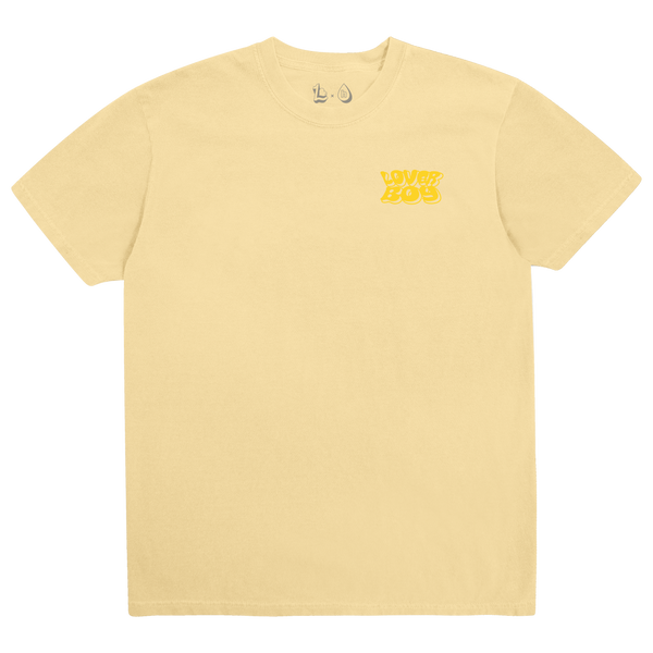 A pale yellow short-sleeve crewneck t-shirt with a small yellow 'LOVE BOY' graphic printed on the left chest, displayed on a clean white background.